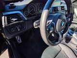 the interior of a car with a steering wheel, dashboard and dashboard controls