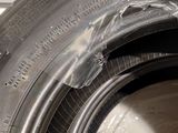 a close up of a tire with a hole in the tire