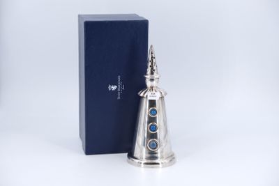 an image of a silver bell with a blue box in the background