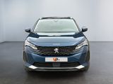 the front view of a blue peugeot v - cross parked in a room