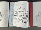 a book with a drawing of a man in a hat on it