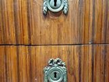 an image of a wooden chest of drawers in a room