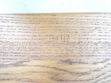 a close up of a piece of wood with writing on it