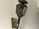 a light that is hanging on the wall next to a lamp