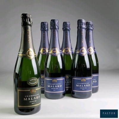 six bottles of champagne are lined up on a table