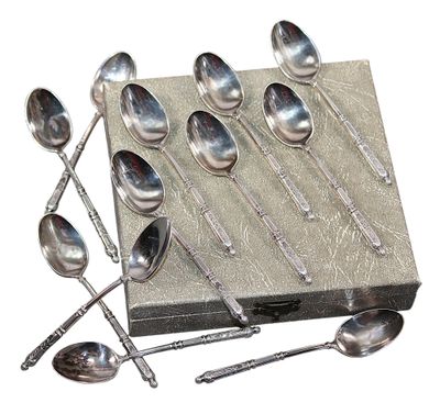 a lot of spoons and spoon spoons sitting on a box