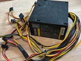 an image of a computer power supply unit on a wooden floor
