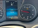 a car dashboard with a speedometer and a clock on it