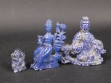 three figurines that are sitting on a table