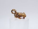 a close up of a figurine of a leopard on a pedestal