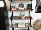 a book shelf that has a lot of books on it