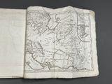 an open book with a map of the world on it