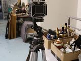 a camera that is sitting on a tripod in a room