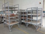 many shelves that are stacked up in a room