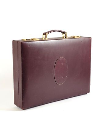 brown leather briefcase sitting on a white surface with a white background