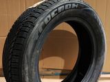a close up of a tire on a cardboard box on a floor