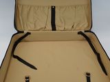 a black suitcase with a black handle on a white background