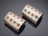 pair of silver and coral inlay cuff bracelets