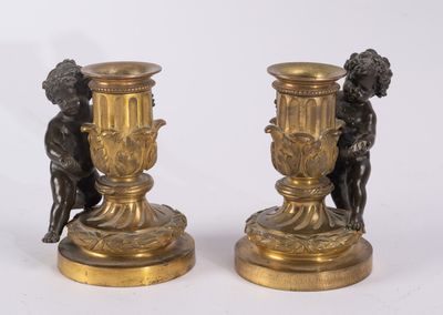 pair of antique bronze candlesticks with cherenshes and cherenshes
