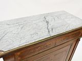 a marble top on the top of a wooden cabinet