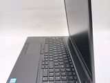 a laptop that is sitting on a white table