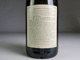 a bottle of wine that is sitting on a table