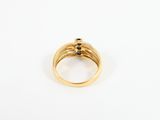 an 18k yellow gold ring set with a black diamond