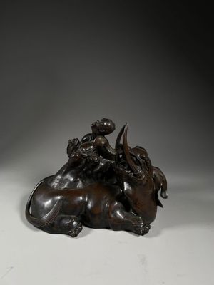 an image of a bronze statue of a man riding on a horse