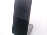 a cell phone that is sitting on top of a stand