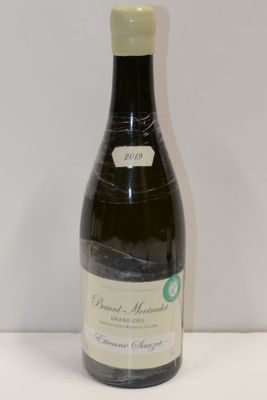 a bottle of wine that is sitting on a table