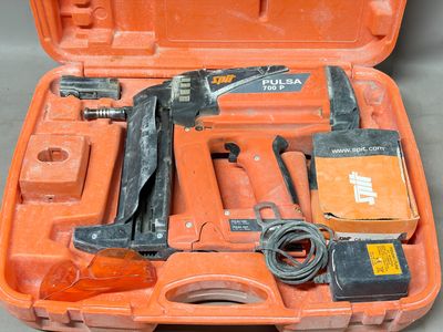 a tool kit in a case with a hammer and other tools
