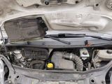 the engine of a car with its hood open and the hood open