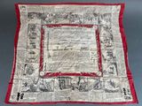 an image of a red and white scarf with a picture of people on it