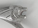 a close up of a metal object with a lion on it