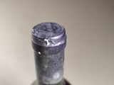 a bottle of wine that is sitting on a table