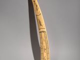 a toothbrush that has been carved with writing on it