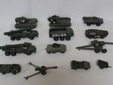 a lot of toy army vehicles on a white surface