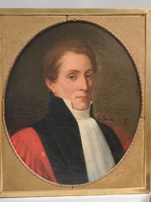 portrait of a man in a red coat and black jacket