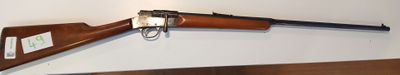 a rifle that is on display on the wall