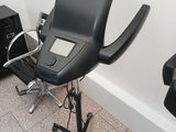 an image of a salon chair with a hair dryer on it