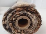 the roll of wool is rolled up on a white surface