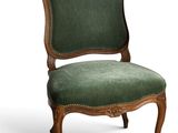 an image of a chair with a green upholstered seat