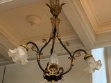 a chandelier hanging from the ceiling in a room