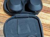an image of a pair of headphones in a case on a wooden floor