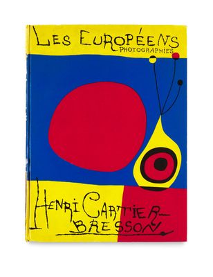 a book with a picture of a red and blue object on it