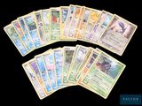 several pokemon cards are stacked on top of each other on a black background