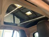 a view of the sunroof from inside of a car
