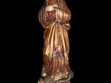 a statue of a woman with a snake in her hand