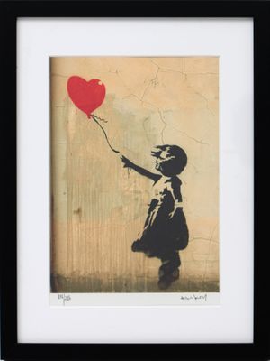 Reproduction encadrée « La fille de Banksy avec un ballon en forme de cœur »