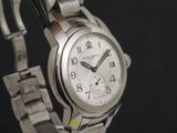 a close up of a wrist watch on a metal bracelet